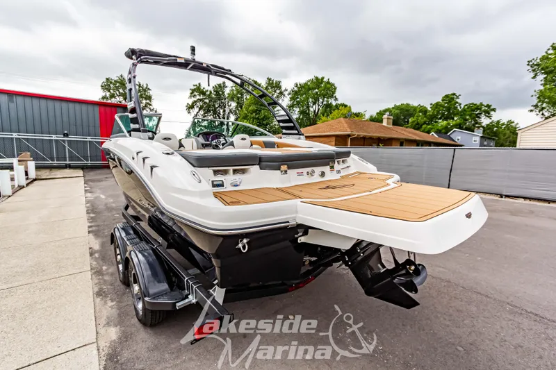 Slide: The Image of 2025 Chaparral 21 SSi boat at Lakeside Marina, rear view. - 6