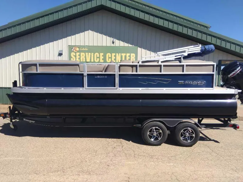 The Image of 2024 Ranger Reata 200C pontoon boat on trailer at service center. - 0