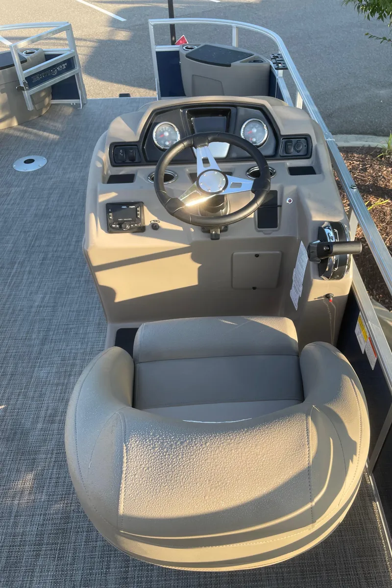 Slide: The Image of 2024 Ranger Reata 200F boat cockpit with steering wheel and control panel. - 4