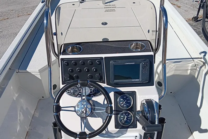 Slide: The Image of 2024 Ranger RB200 boat console with steering wheel, gauges, and navigation system. - 4