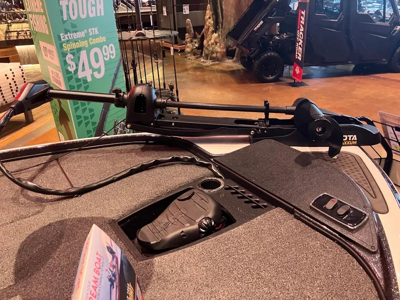 Slide: The Image of 2024 Nitro Z18 boat deck with trolling motor and control panel in showroom. - 3