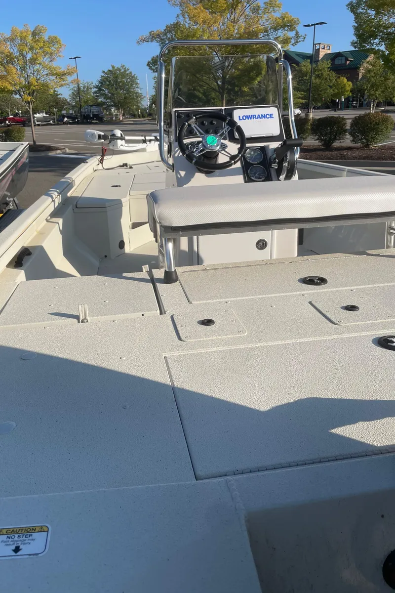 Slide: The Image of 2024 Ranger RB200 boat with Lowrance system, parked outdoors. - 2