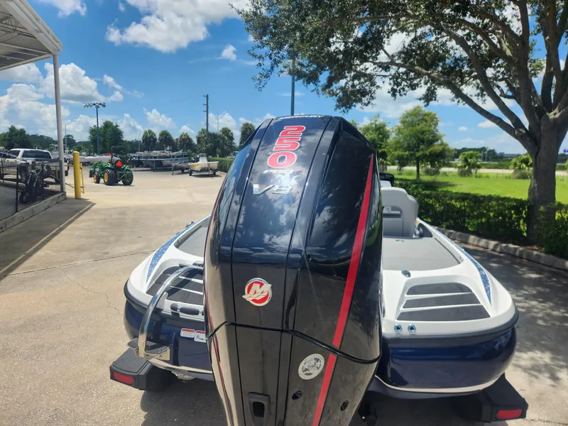 Slide: The Image of 2024 Nitro Z20 boat with powerful 250 V8 engine, parked outdoors under a clear sky. - 4