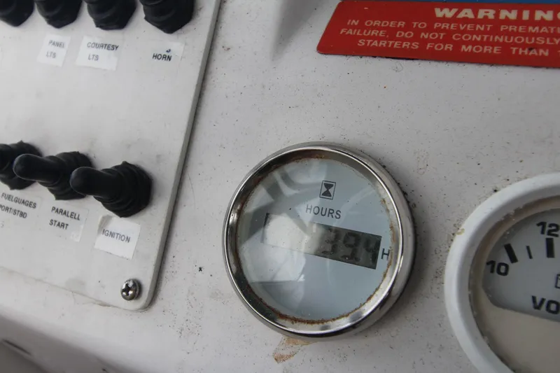 Slide: The Image of Control panel of 1999 Mainship 31 Sedan Bridge with hour meter reading 139.4 hours. - 17