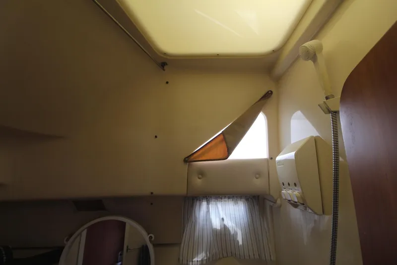 Slide: The Image of Interior cabin of 1999 Mainship 31 Sedan Bridge with window and light fixture. - 27