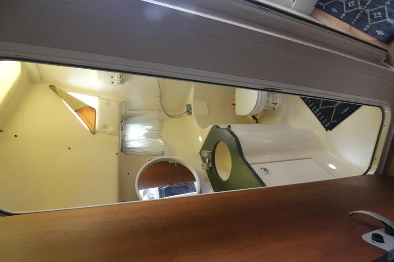 Slide: The Image of Interior of 1999 Mainship 31 Sedan Bridge bathroom with sink and toilet. - 34