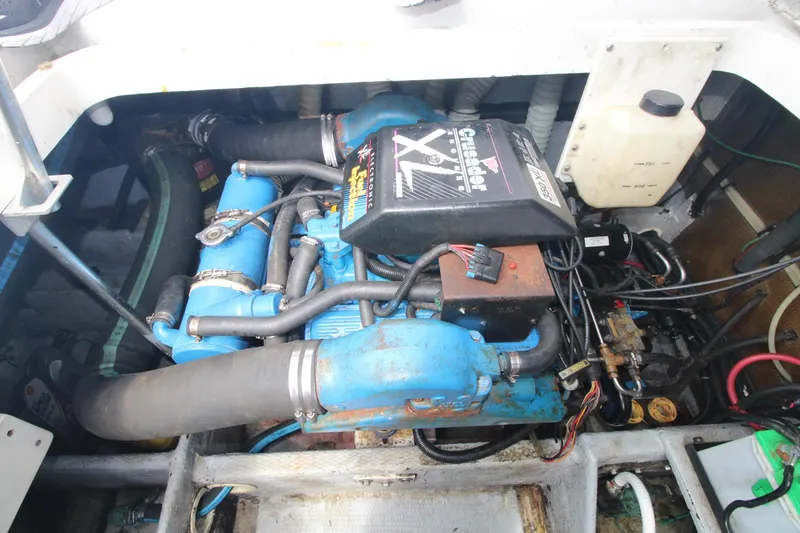 Slide: The Image of Engine compartment of a 1999 Mainship 31 Sedan Bridge with Crusader XL engine. - 44