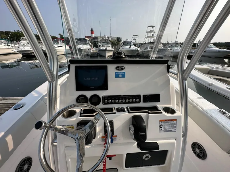 Slide: The Image of 2023 Sea Fox 228 Commander boat dashboard with Garmin display at marina. - 11
