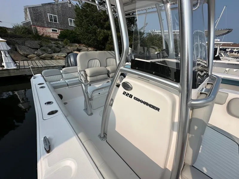 Slide: The Image of 2023 Sea Fox 228 Commander boat docked, featuring sleek design and comfortable seating. - 4