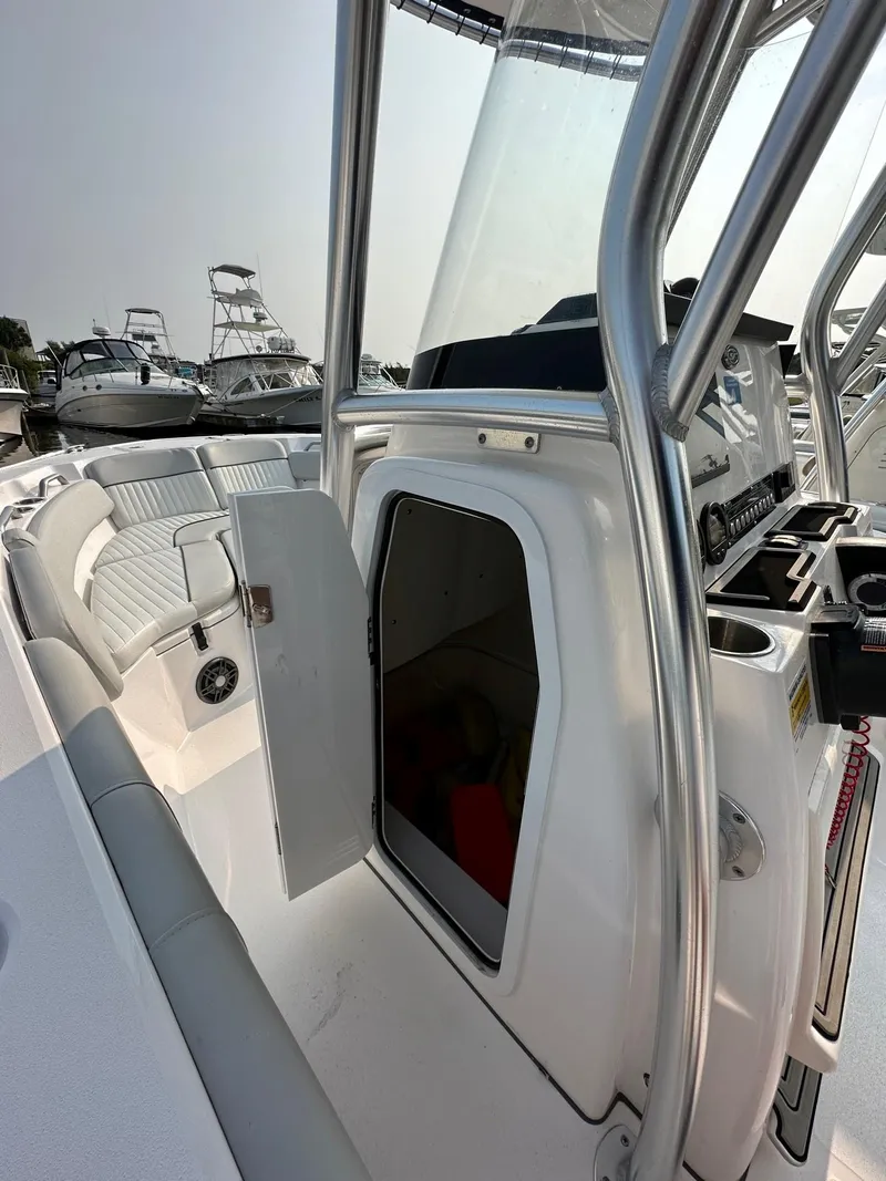 Slide: The Image of 2023 Sea Fox 228 Commander boat interior with open storage compartment. - 9