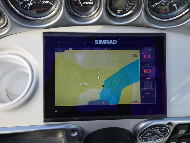 Slide: The Image of Simrad navigation display on 2006 Crownline 255 CCR boat dashboard. - 13