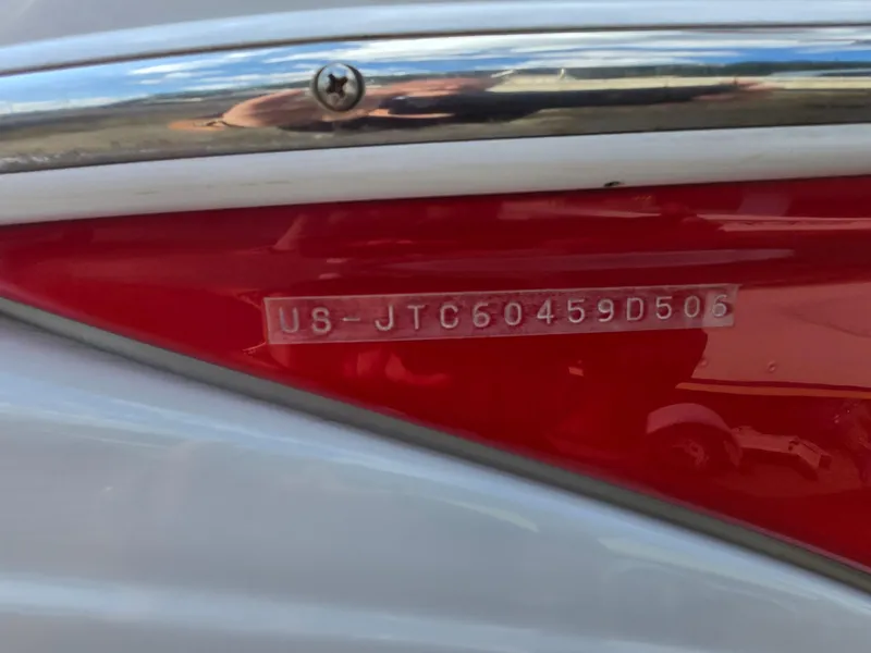 Slide: The Image of 2006 Crownline 255 CCR boat hull identification number on red and white surface. - 24