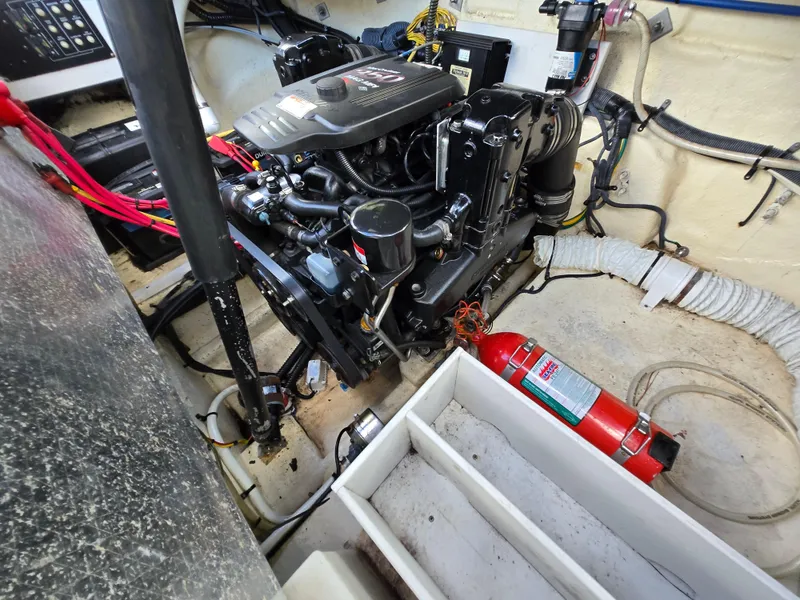 Slide: The Image of Engine compartment of a 2006 Crownline 255 CCR boat, featuring a fire extinguisher. - 7