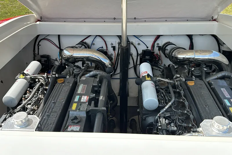 Slide: The Image of Dual engines in a 2004 Hustler 388 SLINGSHOT boat, showcasing powerful performance. - 19