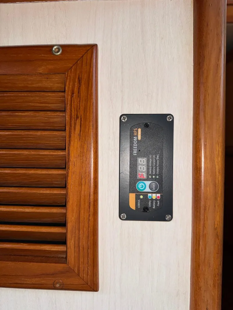 Slide: The Image of Control panel on 1987 Kadey-Krogen Silhouette yacht with wooden vent detail. - 16
