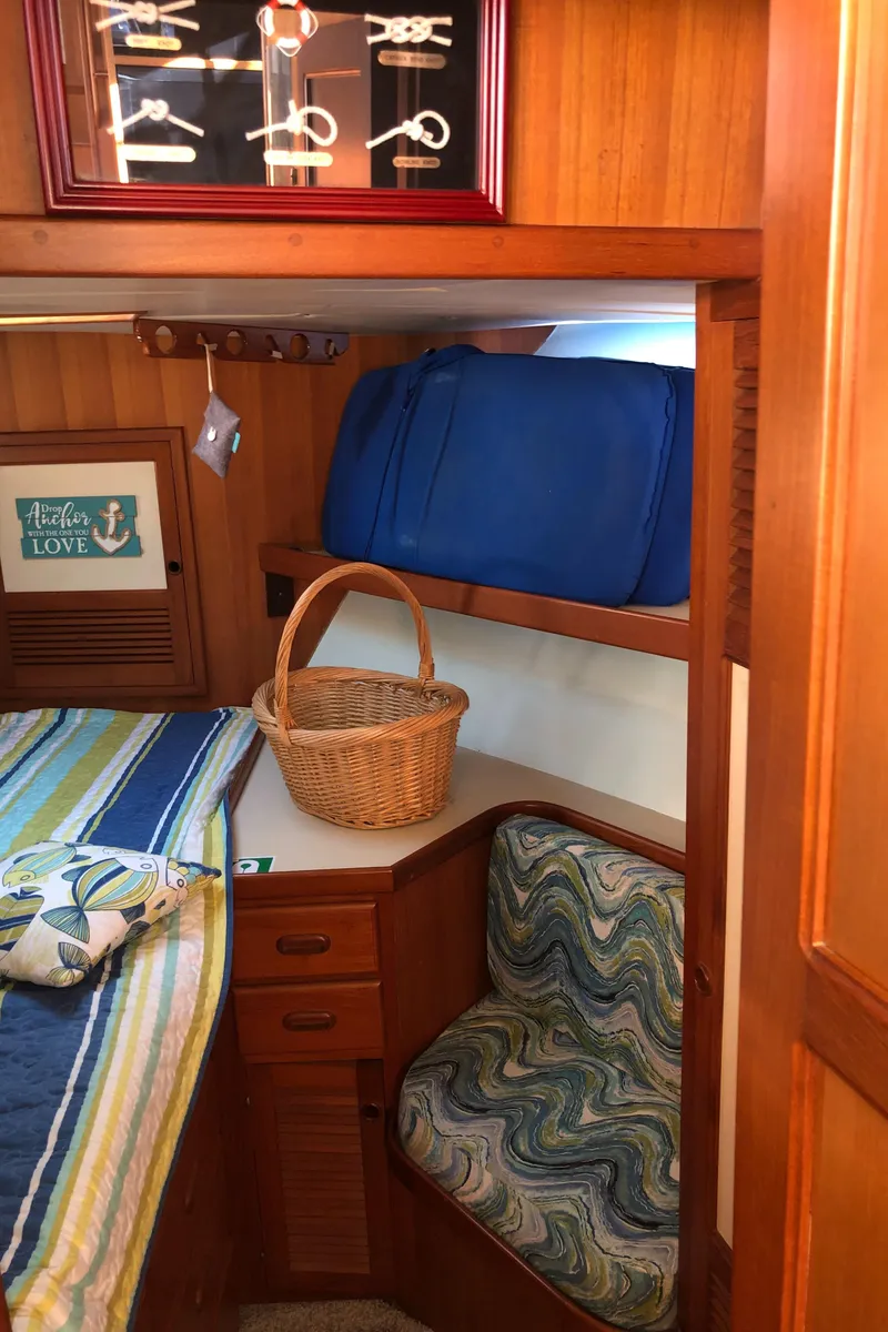 Slide: The Image of Cozy cabin interior of 1987 Kadey-Krogen Silhouette with wooden furnishings and nautical decor. - 23