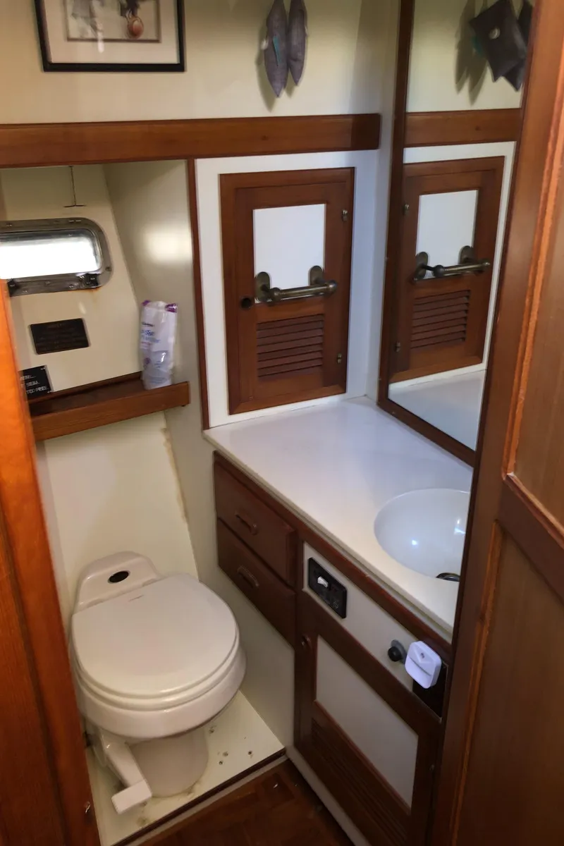 Slide: The Image of 1987 Kadey-Krogen Silhouette yacht bathroom with wooden cabinetry and compact design. - 26