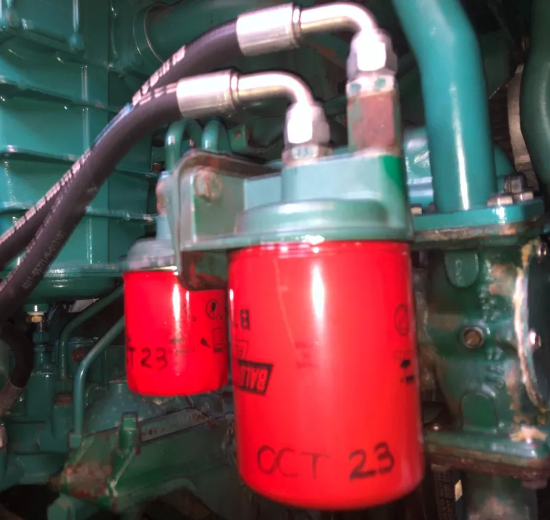 Slide: The Image of Engine components of a 1987 Kadey-Krogen Silhouette with red filters and hoses. - 31