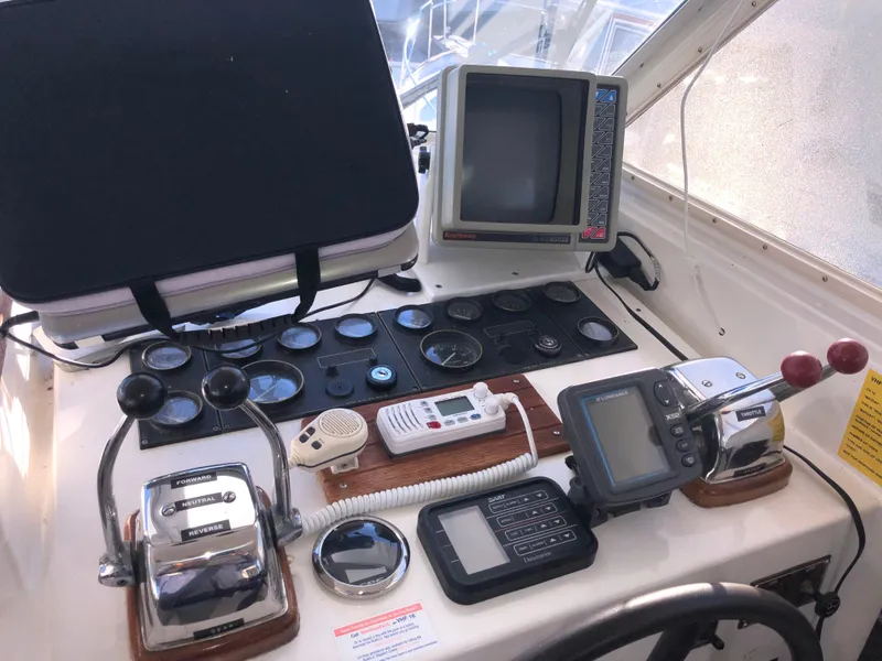 Slide: The Image of 1987 Kadey-Krogen Silhouette helm with navigation equipment and controls. - 35