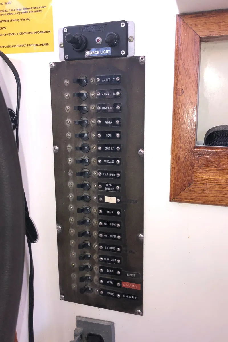 Slide: The Image of Electrical panel on a 1987 Kadey-Krogen Silhouette boat, featuring multiple switches and controls. - 37
