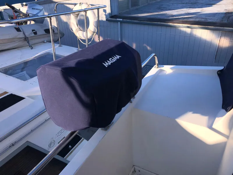 Slide: The Image of 1987 Kadey-Krogen Silhouette boat deck with covered Magma grill. - 38