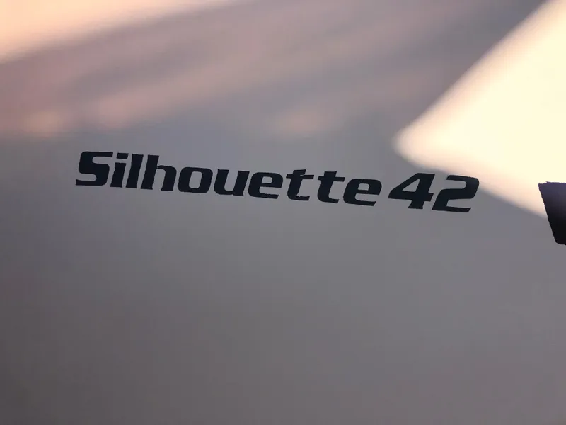 Slide: The Image of Kadey-Krogen Silhouette 42, 1987 model, boat name on hull. - 40