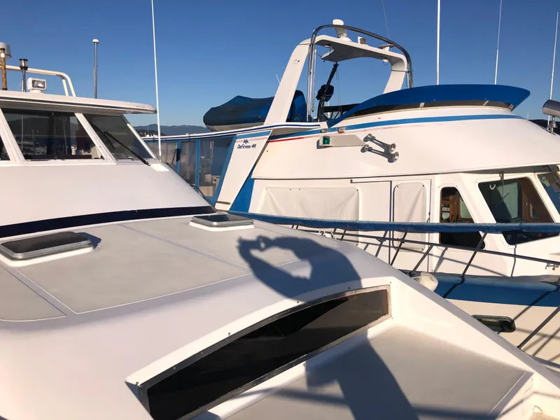 Slide: The Image of 1987 Kadey-Krogen Silhouette yacht docked under clear blue sky. - 41