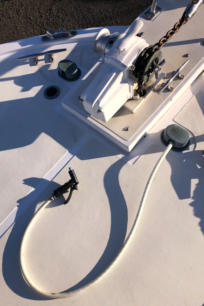 Slide: The Image of 1987 Kadey-Krogen Silhouette boat deck with anchor chain and winch system. - 44