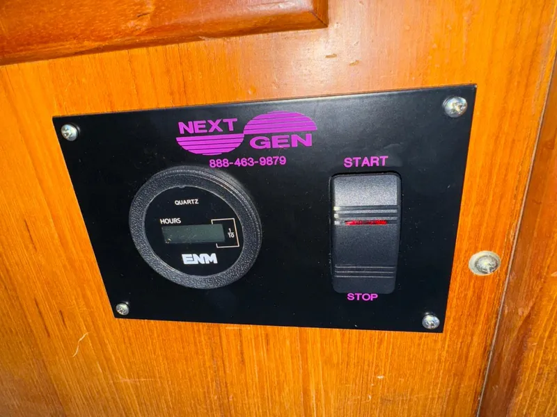 Slide: The Image of Control panel on 1987 Kadey-Krogen Silhouette boat with hour meter and start/stop switch. - 6
