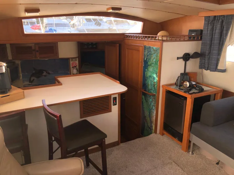Slide: The Image of Interior of 1987 Kadey-Krogen Silhouette yacht with kitchen and seating area. - 9