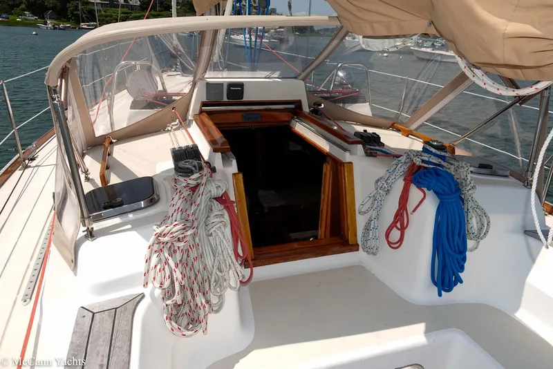 Slide: The Image of 2002 Tartan 3700 sailboat cockpit with ropes and open cabin entrance. - 7