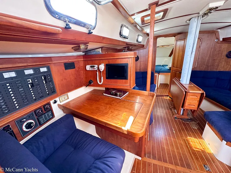 Slide: The Image of Interior of 2002 Tartan 3700 yacht with wood finish and navigation equipment. - 9