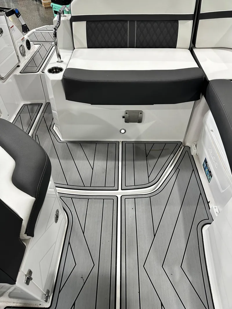 Slide: The Image of 2024 Monterey M6 boat interior with sleek seating and modern flooring design. - 13