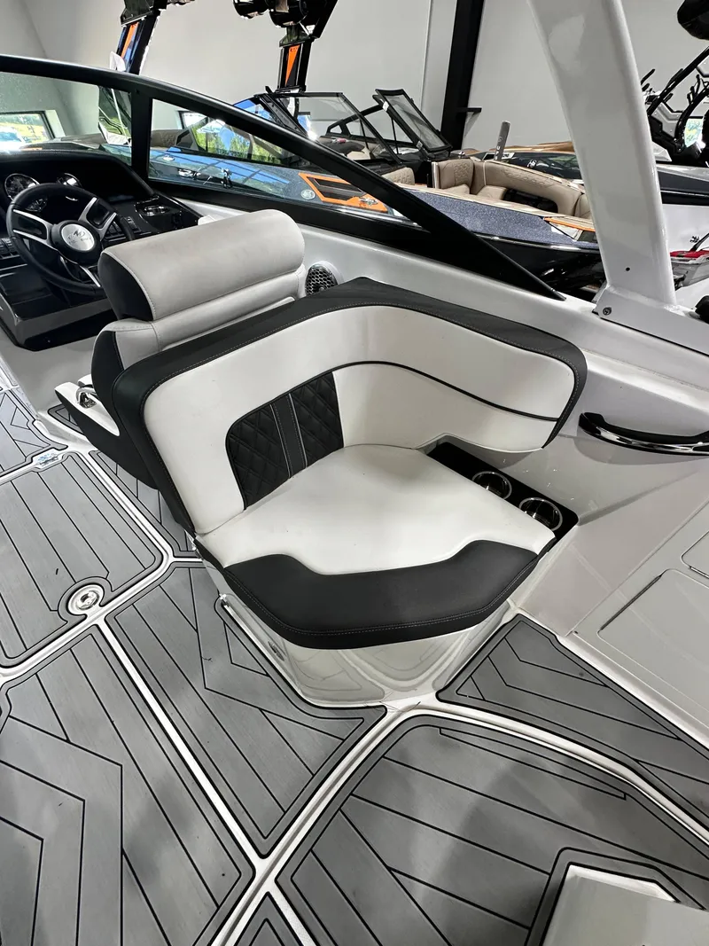 Slide: The Image of 2024 Monterey M6 boat interior with sleek black and white seating. - 15