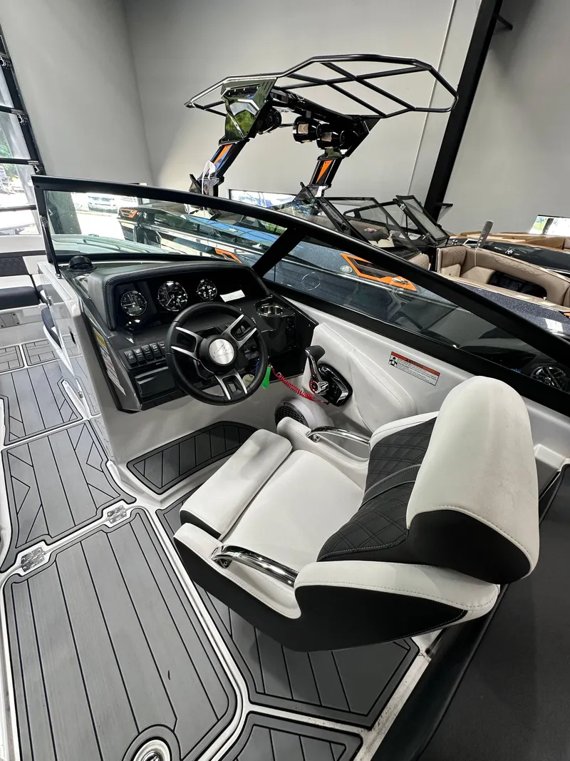 Slide: The Image of 2024 Monterey M6 boat interior with sleek dashboard and modern seating. - 6