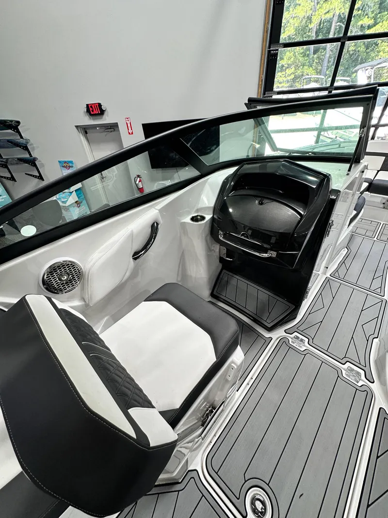 Slide: The Image of 2024 Monterey M6 boat interior with sleek seating and modern dashboard design. - 8