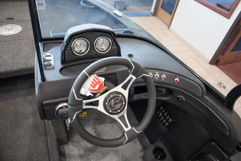 Slide: The Image of 2025 Crestliner 1850 Super Hawk WT JS dashboard with steering wheel and gauges. - 10