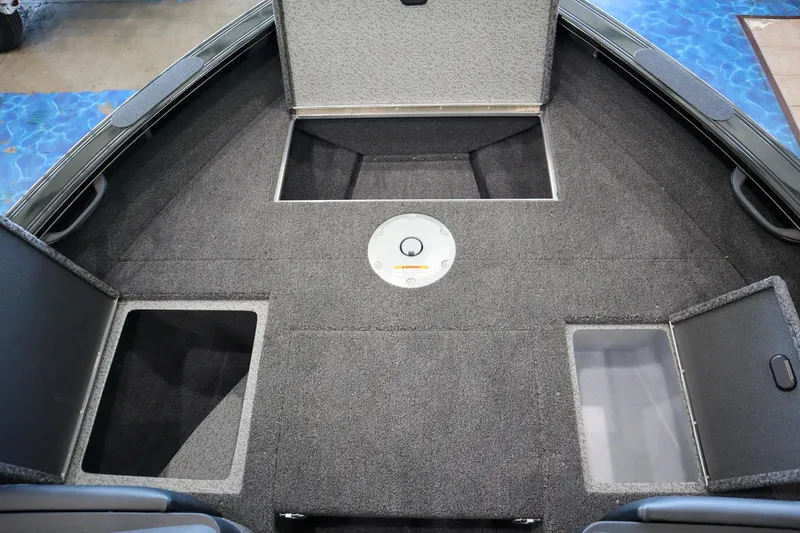 Slide: The Image of 2025 Crestliner 1850 Super Hawk WT JS boat interior with storage compartments. - 13