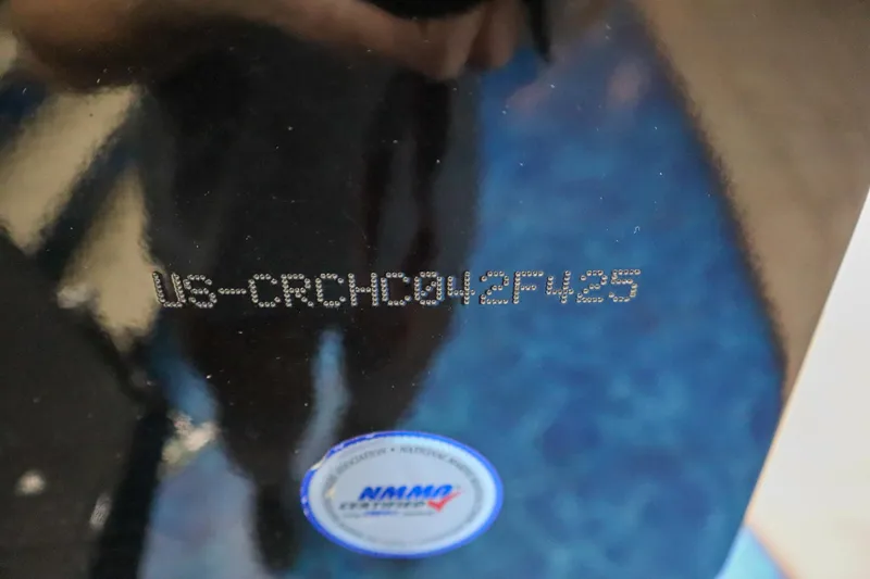 Slide: The Image of Crestliner 1850 Super Hawk WT JS 2025 boat identification number with NMMA certification sticker. - 17