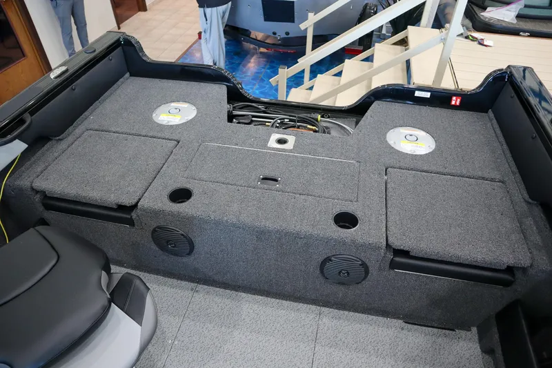 Slide: The Image of 2025 Crestliner 1850 Super Hawk WT JS boat interior with storage compartments and speakers. - 4