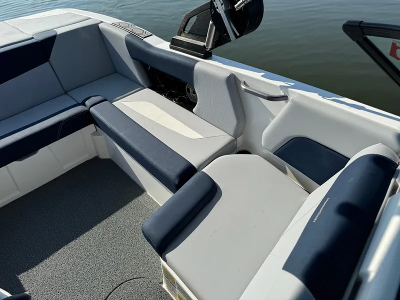 Slide: The Image of 2022 MasterCraft NXT20 boat interior with blue and white seating. - 12