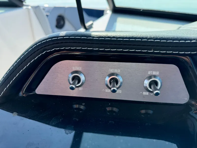 Slide: The Image of 2022 MasterCraft NXT20 dashboard switches for blower, fwd bilge, and aft bilge. - 23