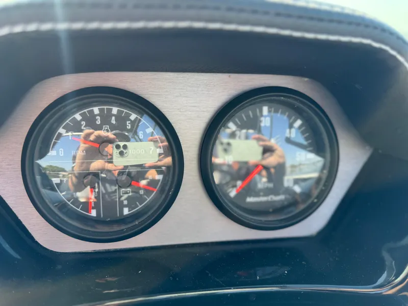Slide: The Image of Close-up of 2022 MasterCraft NXT20 boat dashboard gauges. - 25