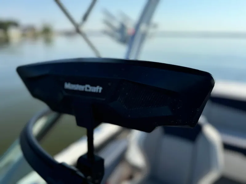 Slide: The Image of Close-up of 2022 MasterCraft NXT20 boat detail with blurred water background. - 28