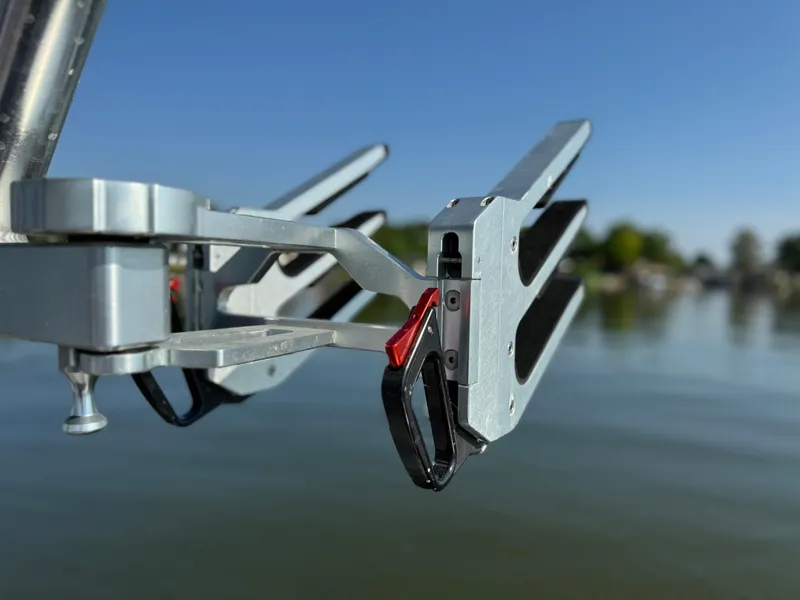 Slide: The Image of Close-up of 2022 MasterCraft NXT20 boat accessory against a serene lake backdrop. - 29