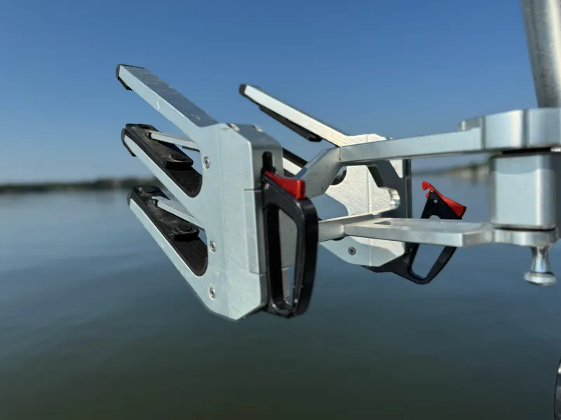 Slide: The Image of MasterCraft NXT20 2022 wakeboard rack on calm lake background. - 30