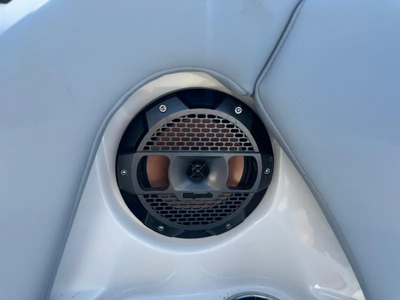 Slide: The Image of 2022 MasterCraft NXT20 boat speaker detail with black grille. - 32