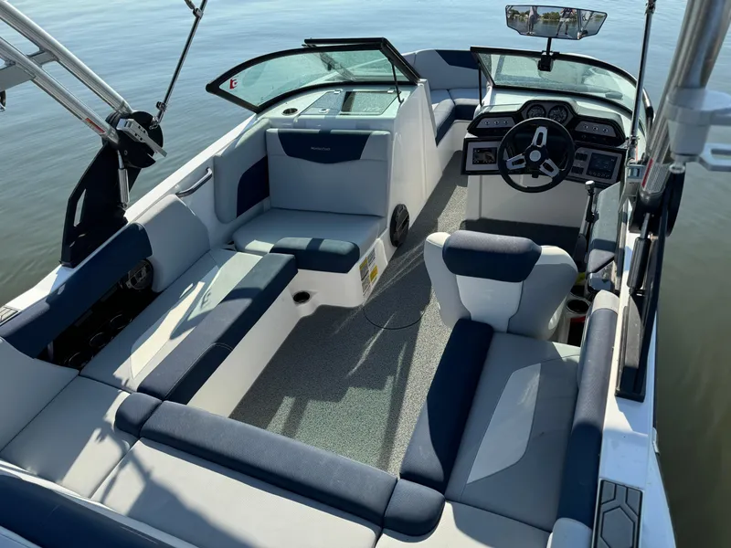 Slide: The Image of 2022 MasterCraft NXT20 boat interior with seating and dashboard. - 6