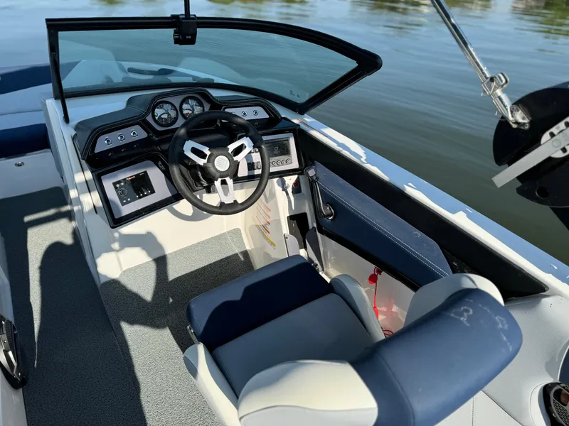 Slide: The Image of 2022 MasterCraft NXT20 boat interior with modern dashboard and steering wheel. - 7