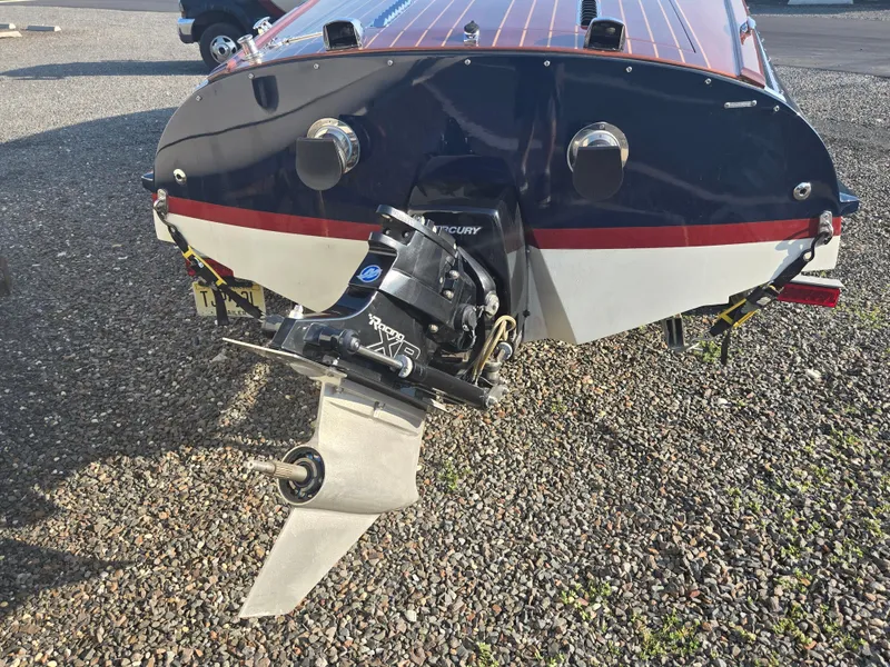 Slide: The Image of Rear view of a 2018 Cherubini Classic 24 boat with Mercury outboard motor. - 11